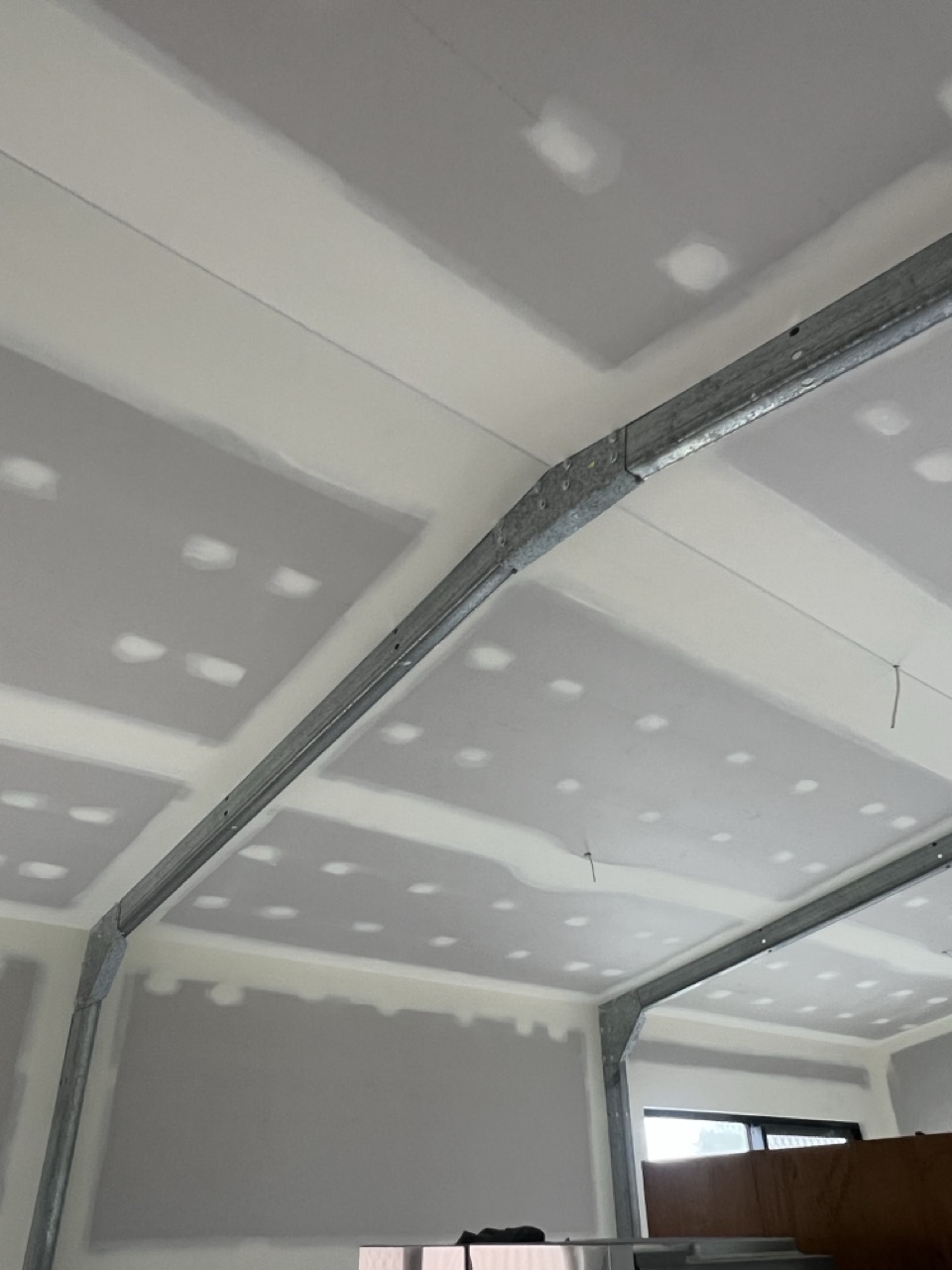 Raked ceiling and square-set plastering by Perks Plastering