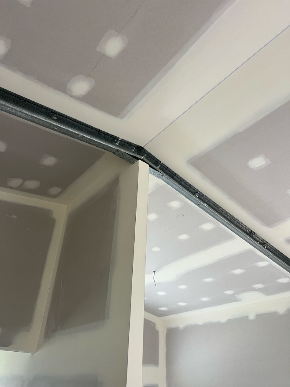 Paint-ready plasterboard ceiling finished by Perks Plastering
